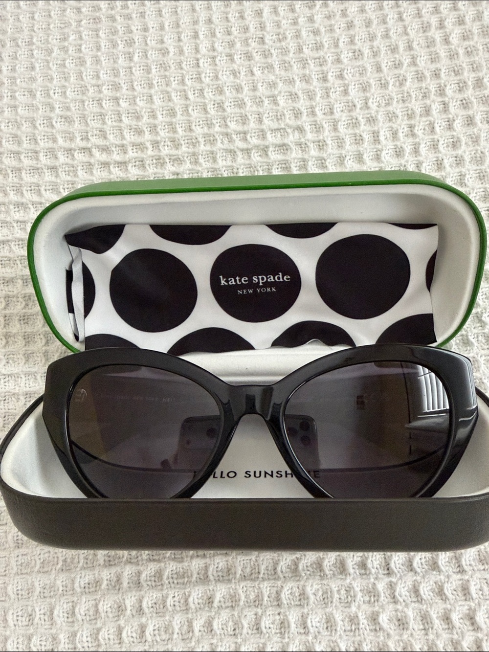 Kate Spade Black Cat-Eye Sunglasses with dark polarized lenses
